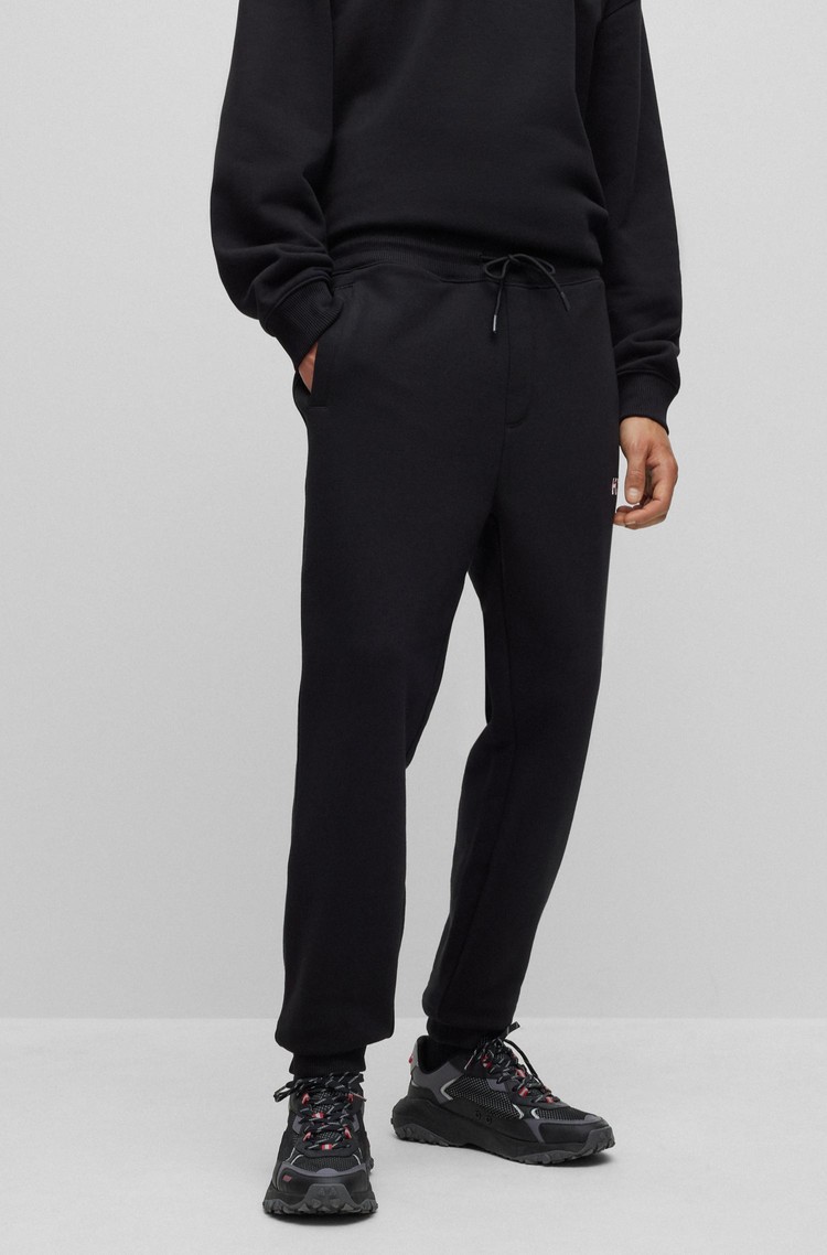 HUGO - Straight-leg tracksuit bottoms with flock-print stacked logos